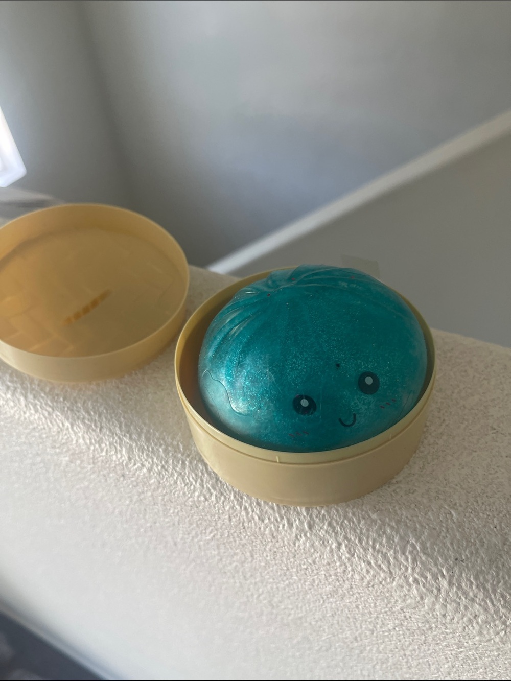 Kids Teal Jelly Bath Slime in Beige Storage Tin - Cute Face